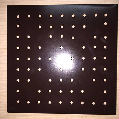 A piece of round hole aluminum perforated sheet with brown coated surface.