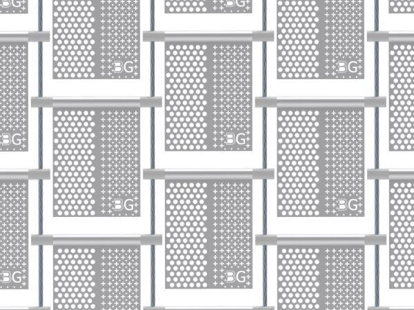 A piece of perforated kinetic facade with big round holes on the left, cross holes and small round on the right in staggered rows.