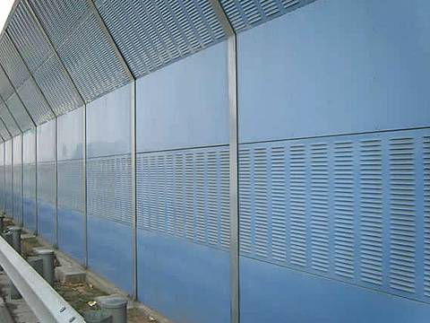 Knuckling shape noise barriers are installed on the highway.