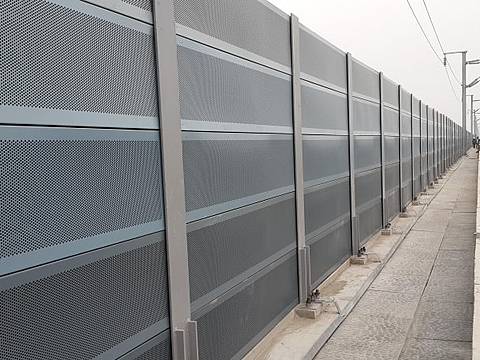 Micro hole noise barriers are installed on the railway.