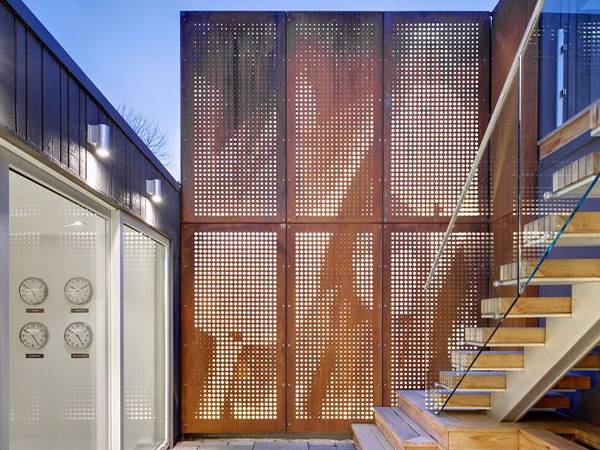 Perforated brass sheets for the fence next to the stairs