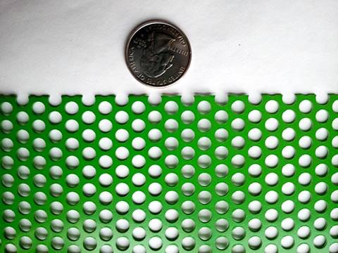 A part of powder coating perforated sheet is beside a metal coin.