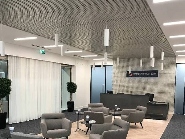 The ceiling of the lounge is decorated with round perforated sheet.