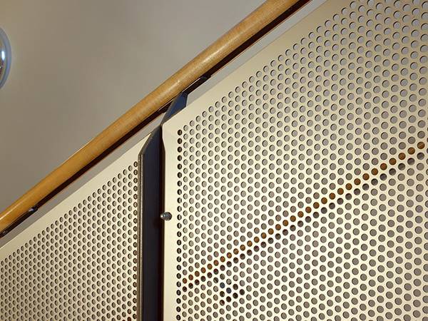 The handrail of the interior stair is decorated with round hole perforated sheet.