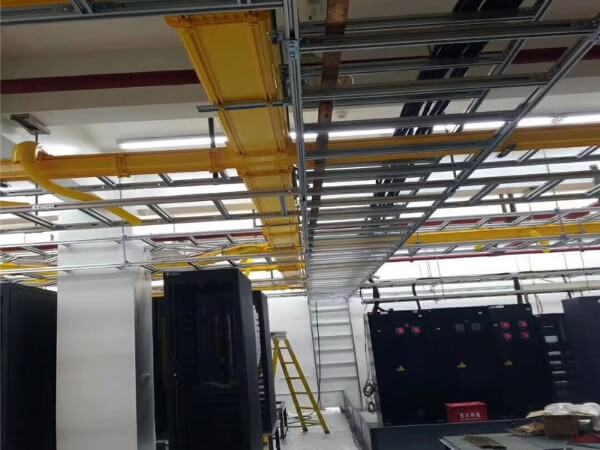 Welded cable trays for connections over corridors